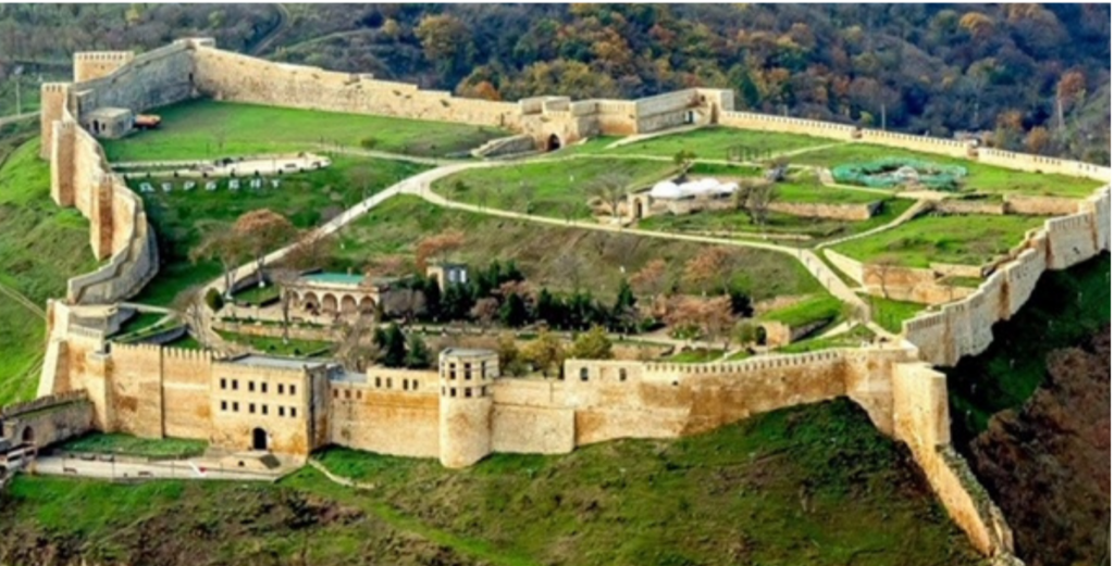 aerial view of land with walls and buildings