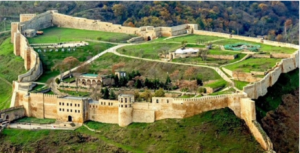 aerial view of citadel with fortress wall and green land, some buildings