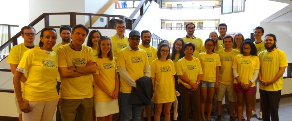 Group of students and faculty in yellow t-shirts