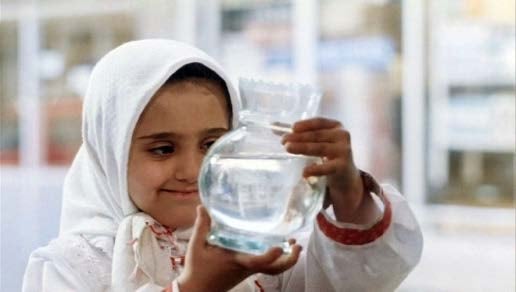 image of girl holding toy