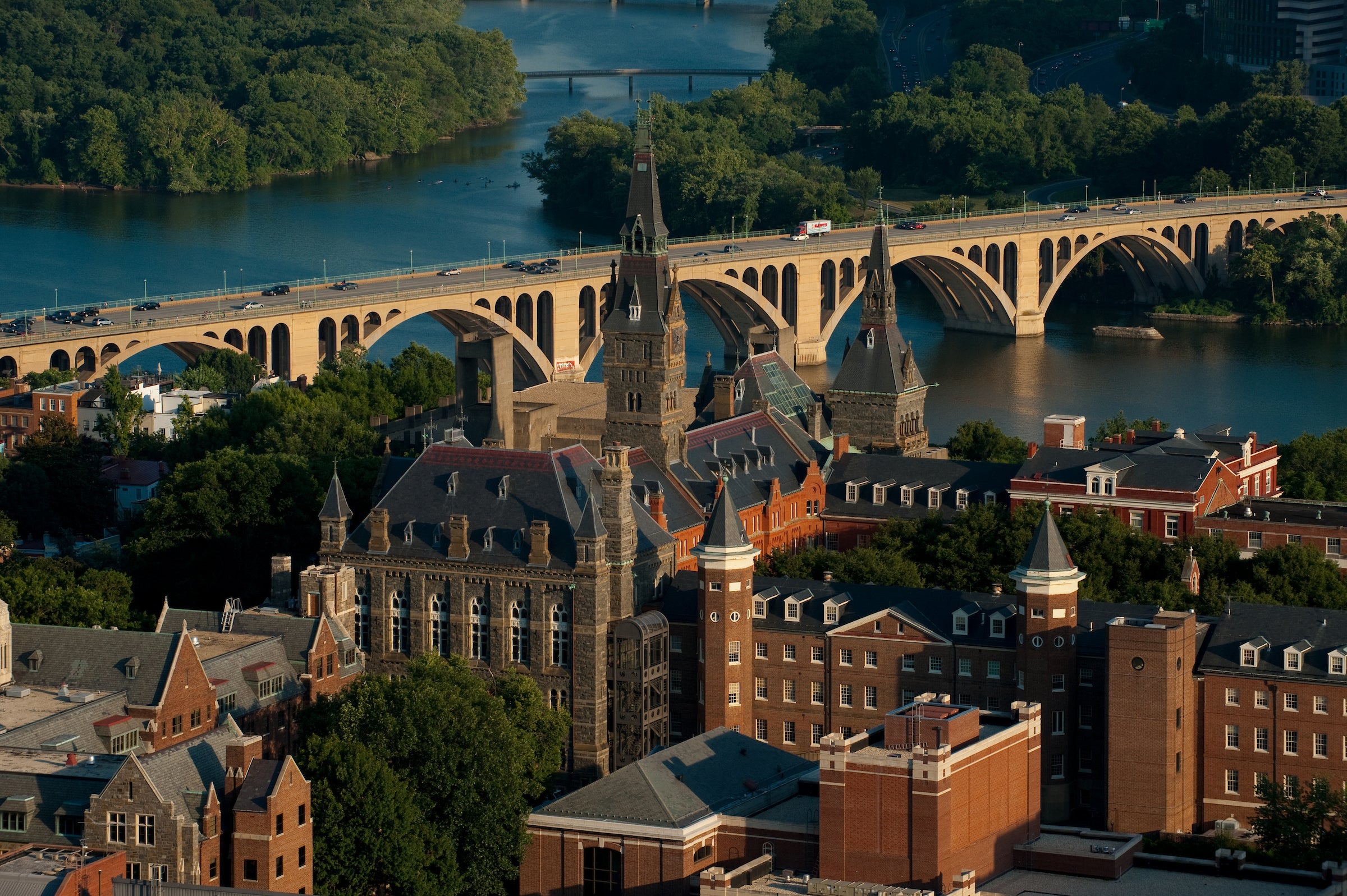 Aerial view of campus and Key Bridge in the distance with the Potomac River