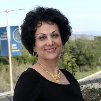 head and shoulders of Iranian woman with short dark hair
